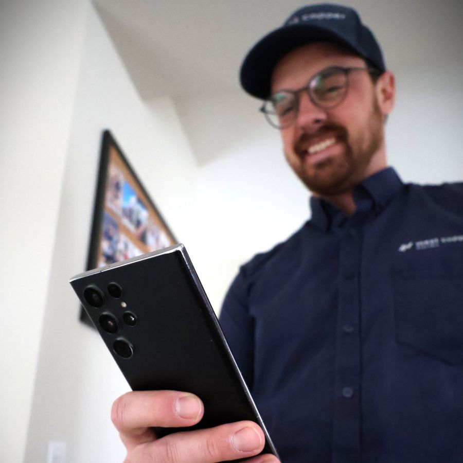 Electrician making a quote for electrical work usint The Going Rate app.